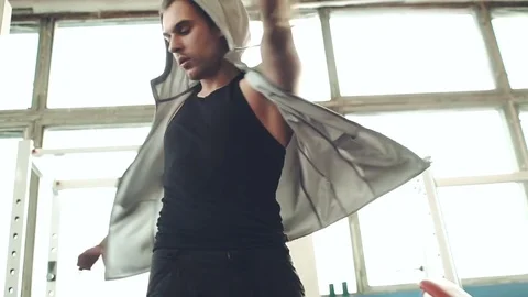 Bodybuilder or athlete does movement exercise for back and shoulders, in gym. Video stock 72029080