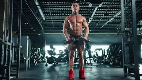 Bodybuilder Performing Dumbbell Lateral Raises for Shoulder Muscles Video stock 268833259