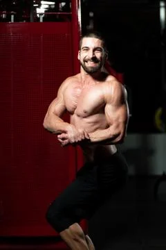 Bodybuilder Performing Side Chest Pose Stock Photos