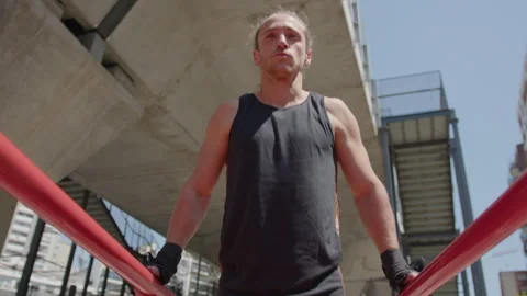 Bodybuilder Performing Tricep Dips on Parallel Bars Outdoor Stock-Footage 260050024