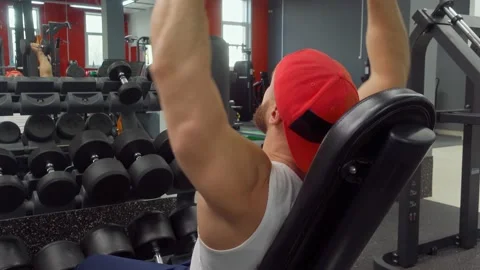 Bodybuilder performs exercise with dumbbells on the biceps and back muscles in Stock Footage 189950671