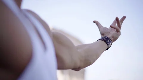 Bodybuilder posing for advertisement . Young man demonstrating his muscles on Video stock 92231250