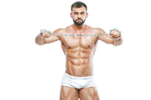 Bodybuilder posing. Beautiful sporty guy male power. Fitness muscled manin white Stock Photos