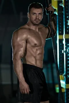 Bodybuilder posing in the gym Stock Photos