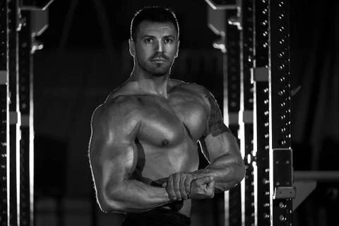 Bodybuilder posing in the gym Stock Photos