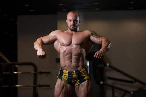 Bodybuilder Posing In The Gym Stock Photos