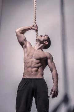 Bodybuilder, posing holding rope Stock Photos