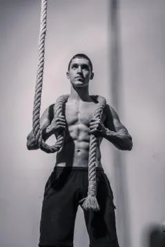 Bodybuilder, posing holding rope Stock Photos