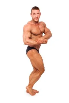 Bodybuilder posing isolated. Stock Photos