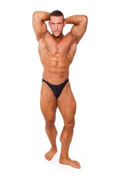 Bodybuilder posing isolated. Stock Photos