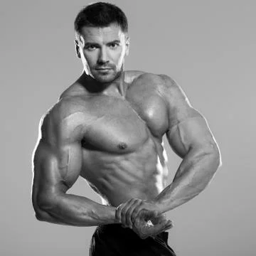 Bodybuilder posing in the studio Stock Photos