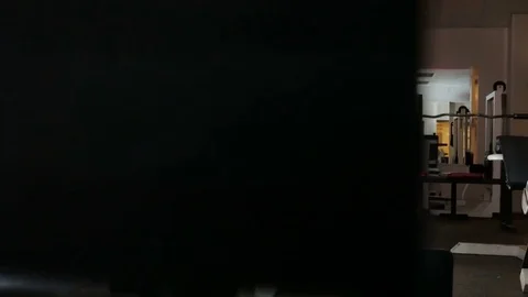 Bodybuilder pulls weight on himself Stock Footage 75807582