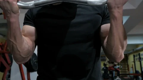 Bodybuilder pumping muscle in the gym, do fitness Video stock 111488480