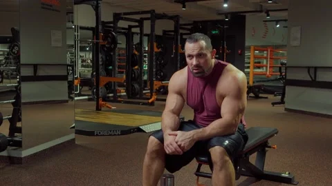 Bodybuilder is resting after workout. Gym,exercise Video stock 194357077