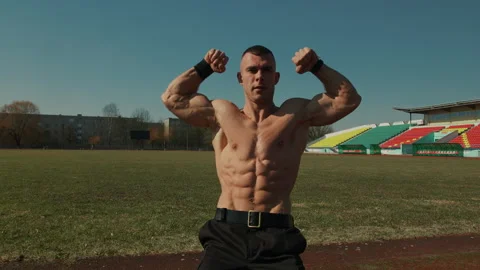 Bodybuilder showing double biceps in front and maximum muscularity. Poses Stock-Footage 273777190