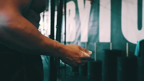 Bodybuilder showing muscular back during pull ups exercise at gym Stock Footage 79394884
