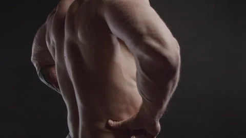 Bodybuilder strains and demonstrates back muscles Stock Footage 173455002