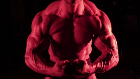 Bodybuilder strains the muscles Stock Footage 132181795
