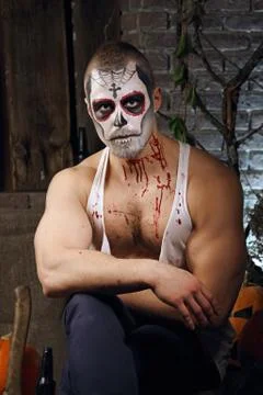 Bodybuilder in sugar skull makeup. Face painting art. Stock-Fotos