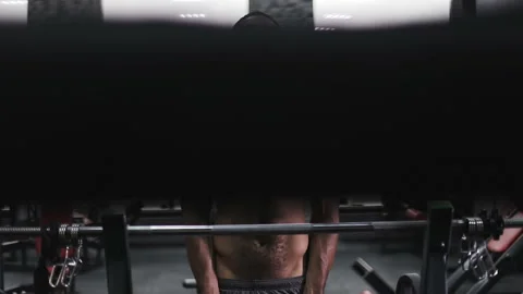 Bodybuilder training biceps and chest with barbell in gym. Stock Footage 101520314