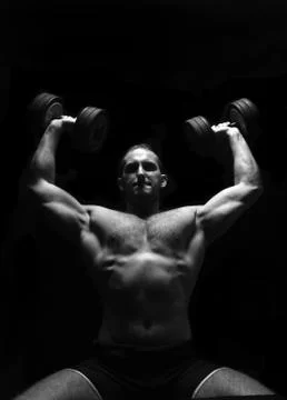 Bodybuilder training in the gym Stock Photos