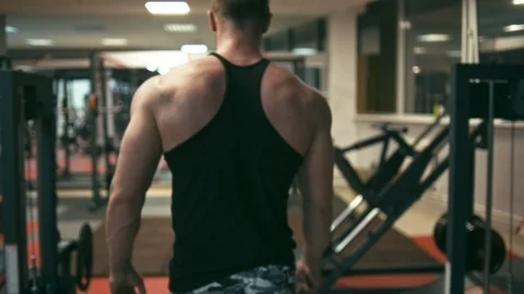 Bodybuilder walking in gym Stock Footage 90308961