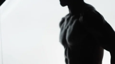 Bodybuilder on white background Video stock 128346519