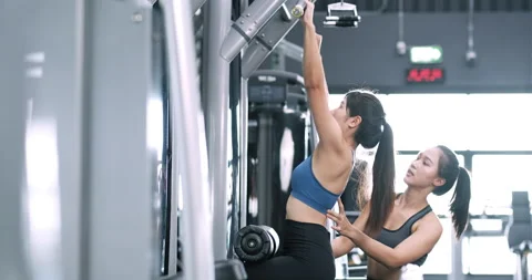 Bodybuilder of women training exercise workout at fitness gym in sportswear Stock Footage 135795418