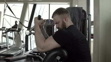 Bodybuilder working on biceps in the gym close-up 4k. Stock Footage 85714617