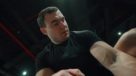 Bodybuilder working out biceps muscles in gym Stock Footage 158755652