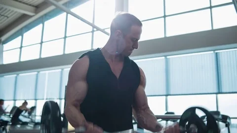 Bodybuilder workout with barbell Stock Footage 82349108