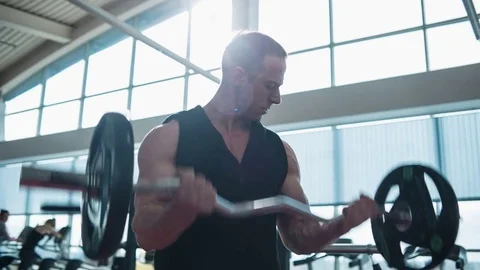 Bodybuilder workout with barbell. Loop Stock Footage 82349202