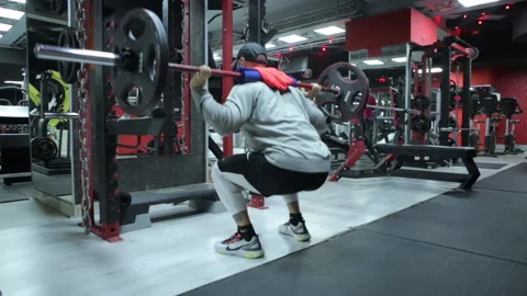 Bodybuilder workout at gym doing Barbell Squat Stock-Footage 143120710