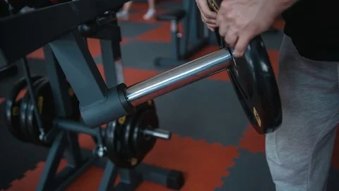 Bodybuilder workout in gym machine Video stock 82352539