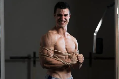 Bodybuilder Wrapt Up With Cable Stock Photos