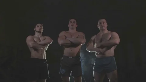 Bodybuilders are three of us, behind the veil dysovaya Stock Footage 73107341