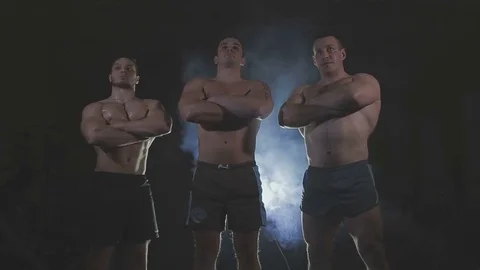Bodybuilders are three of us, behind the veil dysovaya Stock Footage 73107352