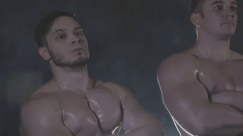 Bodybuilders are three of us, behind the veil dysovaya Stock Footage 73109414