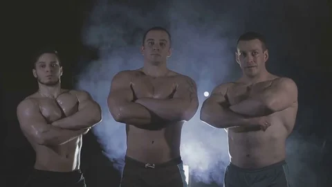 Bodybuilders are three of us, behind the veil dysovaya Stock Footage 73109426