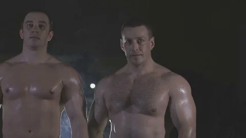 Bodybuilders are three of us, behind the veil dysovaya Stock Footage 73109457