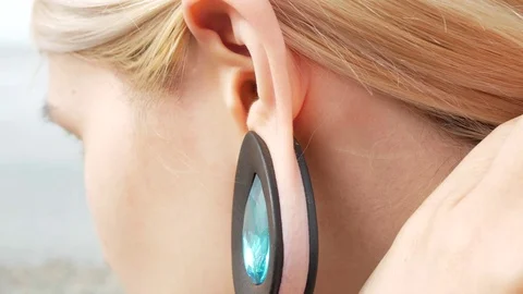 Bodymification. close-up of a young beautiful woman with tunnels in her ears. 4k Stock Footage