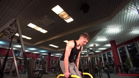 Bodyweight exercise, man standing on hands at gym Stock Footage 72499750