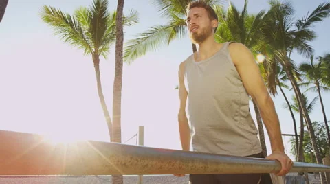 Bodyweight exercises man workout on dips bars - Male fitness model working out Stock Footage 62082859