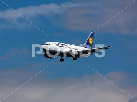 Boeing 737 flies in the sky Stock Photos