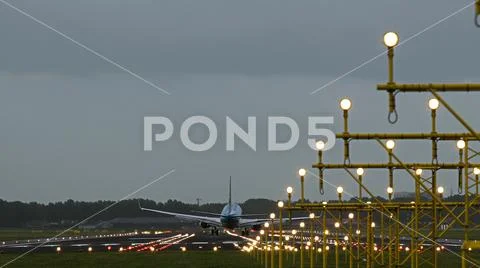 Boeing 737 of KLM airlines landing in the evening Stock Photos