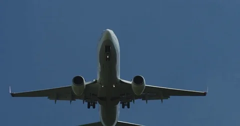 A Boeing 737 lands at an airport, in flight Stock Footage