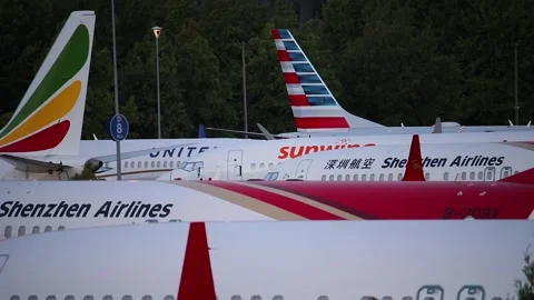 Boeing 737 MAX 8 and 9 airplanes parked next to each other while grounded. Stock Footage 139021179