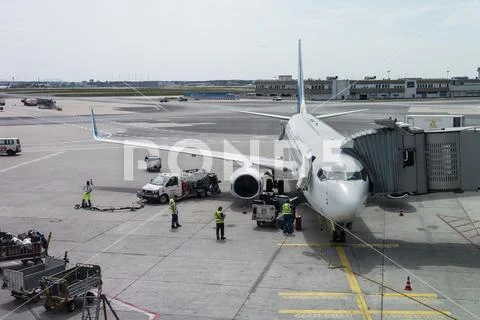Boeing 737 from UIA is being loaded and prepared for its next flight Stock Photos
