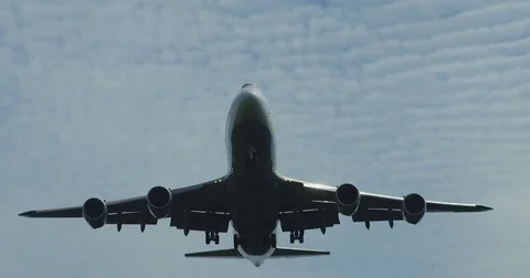 A Boeing 747 lands at an airport, in flight Stock Footage
