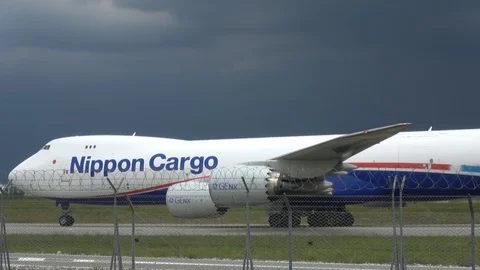 Boeing 747 Nippon Cargo Airlines Taxi On Runway Stock Footage